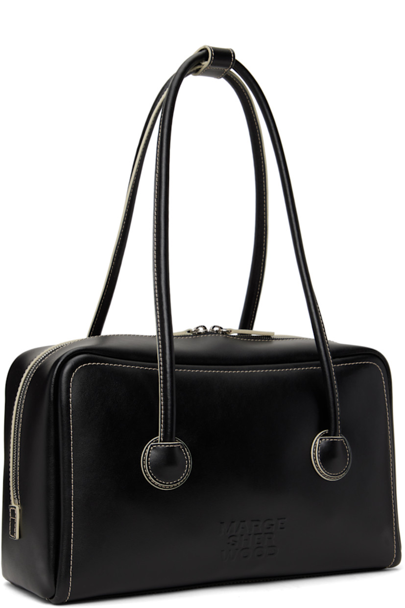 Buffed leather shoulder bag in black.

· Press-stud tab at rolled shoulder straps
· Logo embossed at face
· Two-way zip closure
· Zip and patch pockets at interior
· Logo-woven twill lining
· Contrast stitching in off-white
· H7.5" x W12.5" x D3.5"

Supplier color: Black plain