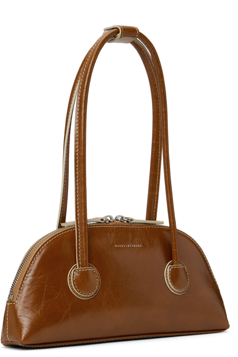 Polished crinkled leather shoulder bag in brown.

· Press-stud tab at rolled shoulder straps
· Logo stamp at face
· Two-way zip closure
· Logo-woven twill lining
· Contrast stitching in off-white
· H5" x W10.5" x D2"

Supplier color: Brown crinkle