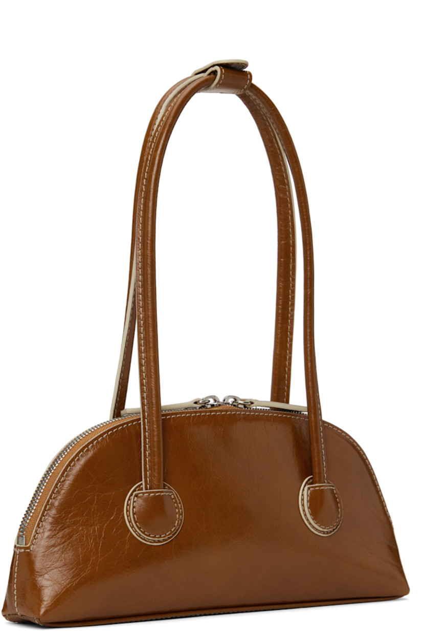 Polished crinkled leather shoulder bag in brown.

· Press-stud tab at rolled shoulder straps
· Logo stamp at face
· Two-way zip closure
· Logo-woven twill lining
· Contrast stitching in off-white
· H5" x W10.5" x D2"

Supplier color: Brown crinkle