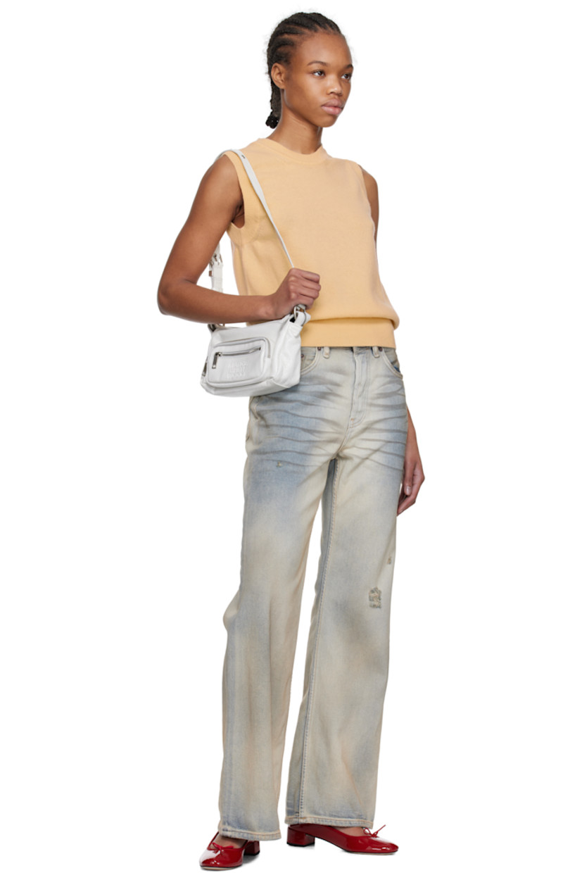 Cracked leather shoulder bag in off-white.

· Adjustable pin-buckle shoulder strap
· Zip pockets at face
· Logo embossed at face
· Two-way zip closure
· Zip and patch pocket at interior
· Logo-patterned moiré lining
· Logo-engraved antiqued silver-tone hardware
· H5" x W9" x D3"

Supplier color: Off white cracked