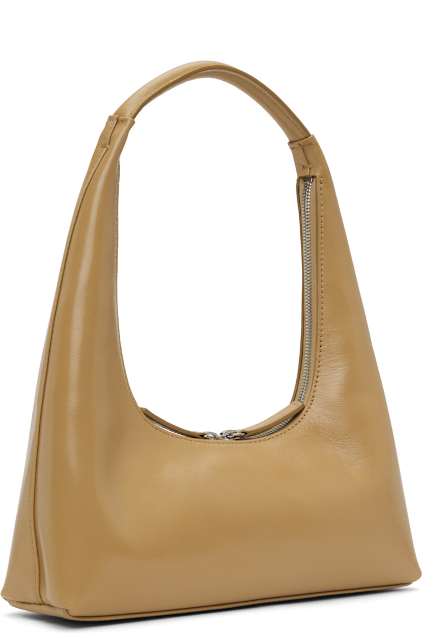 Polished crinkled leather shoulder bag in beige.

· Integrated shoulder strap
· Logo stamp at face
· Two-way zip closure
· Card slot at interior
· Logo-woven twill lining
· H4" x W10.25" x D2.75" 
· Total height: H12.25"

Supplier color: Beige crinkle