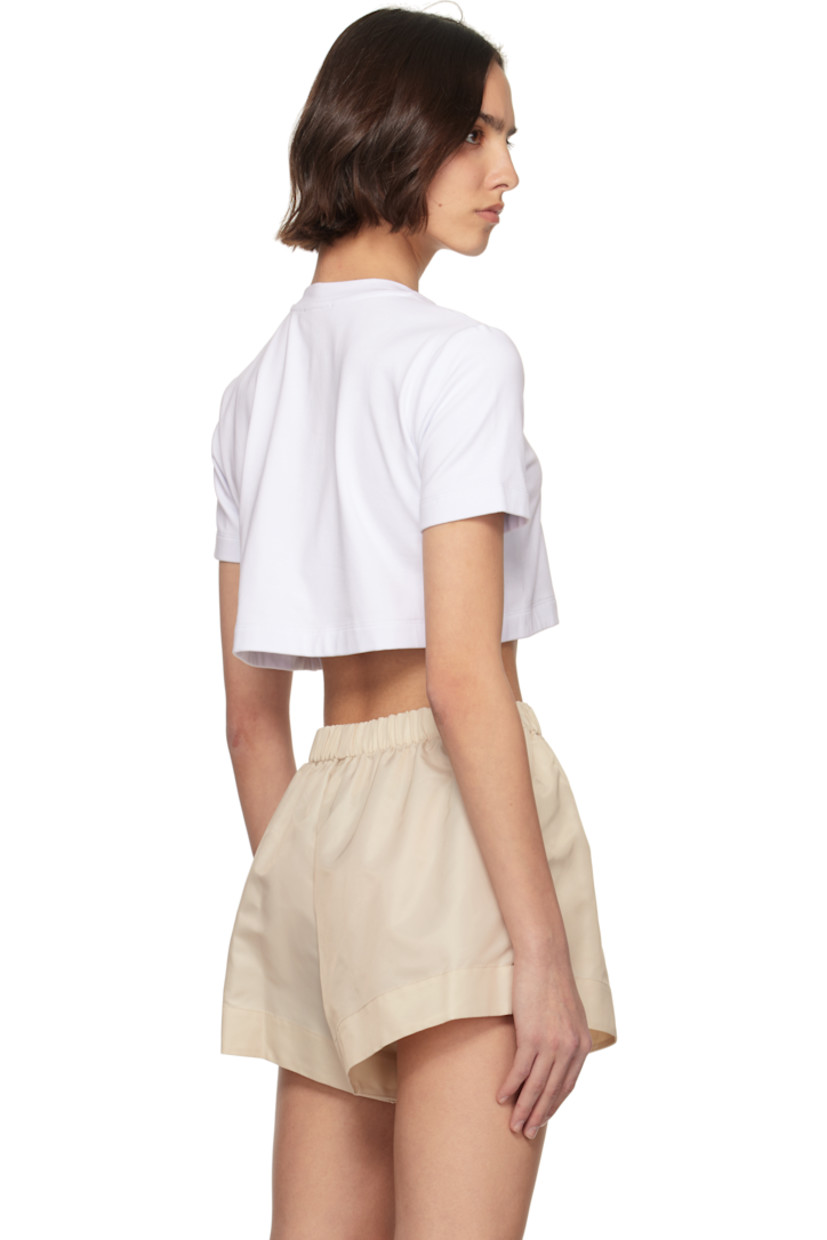 Stretch cotton jersey T-shirt. 

· Crewneck
· Floral appliqué and prong-set crystals at front 
· Cropped hem 

Supplier color: White