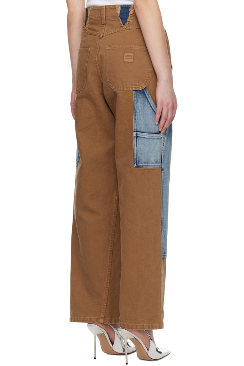 Cotton canvas and non-stretch denim jeans. Fading throughout.

· Straight-leg 
· Paneled construction
· Belt loops
· Four-pocket styling
· Zip fly
· Patch pockets at legs and outseams
· Belt loops at legs
· Hammer loop at outseam
· Frayed edges at back waistband
· Logo patch at back pocket

Supplier color: Brown/Blue