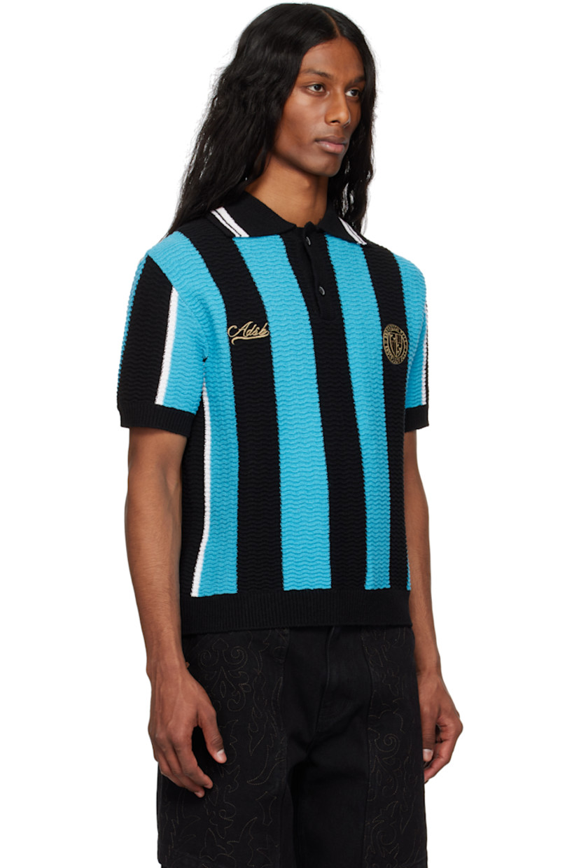 Rib-knit cotton-blend polo. Stripes throughout.

· Spread collar
· Two-button placket
· Embroidered logo and logo patch at chest

Supplier color: Black/Blue
