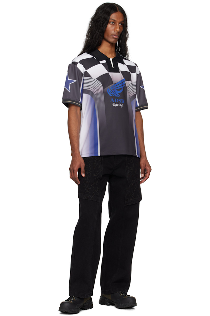 Stretch polyester interlock jersey polo. Graphics printed throughout.

· Paneled construction
· Rib-knit spread collar and cuffs
· Logo graphic printed at front and back
· Stripe at cuffs
· Logo patch at back hem

Supplier color: Blue/Black