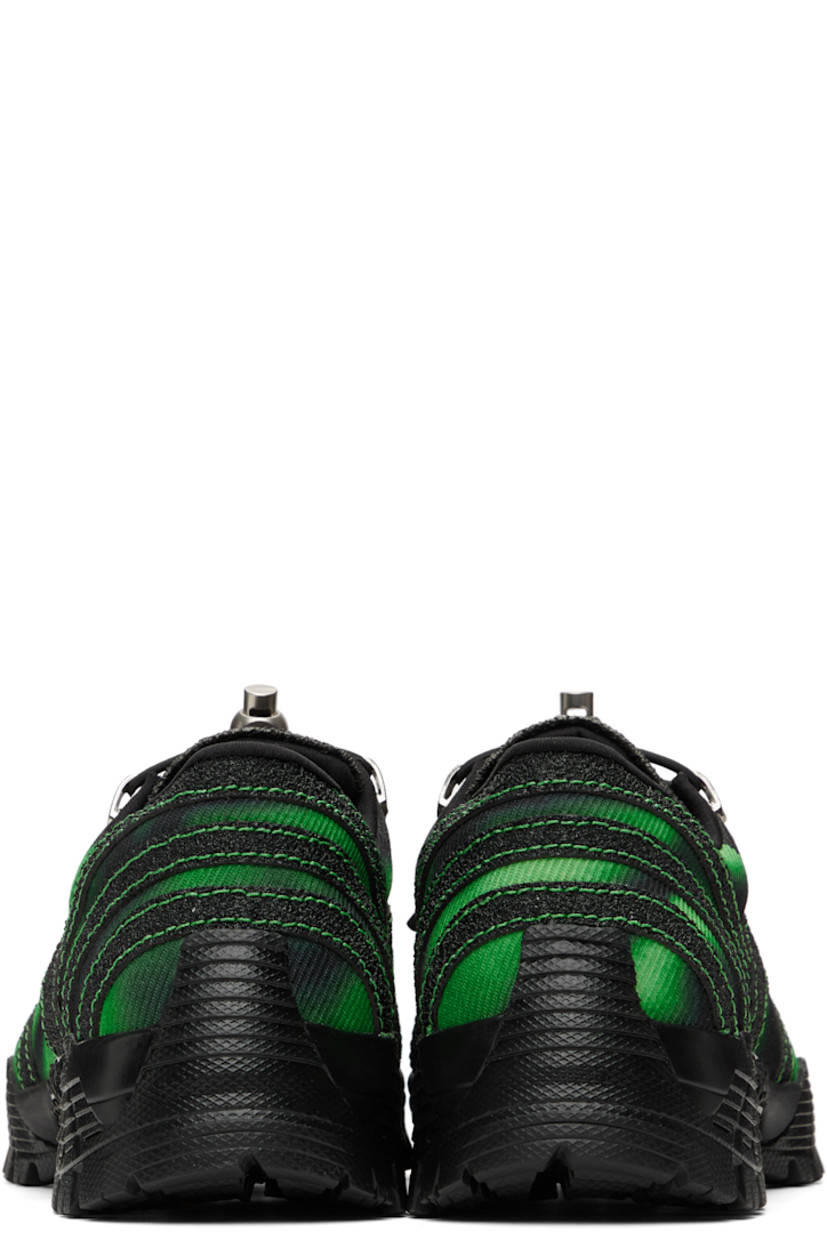Low-top twill, mesh, and textured leather sneakers in green and black.

· Printed pattern and bonded trim throughout
· Square toe
· Bungee-style drawstring closure
· Rubber logo patch at padded tongue
· Padded collar
· Cushioned Ortholite® insole
· Jersey lining
· Treaded Vibram® rubber sole

Supplier color: Green
