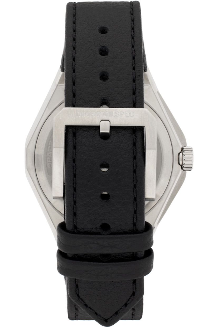 Lugged round case in brushed stainless steel. Markers at rotating bezel. Anti-glare domed sapphire crystal lens. Logo and markers in white and silver tone. Graphic, embossed stripes, and date aperture at laser-engraved gunmetal-tone dial. Logo engraved at fluted screw-down crown.

Pebble-grained leather strap in black with logo-etched pin-buckle fastening.

Sellita SW200-1 automatic movement. 200m water resistance. Swiss-made. Flat sapphire crystal exhibition case back.

Approx. 42 mm case length x 12 mm case height; 0.75” strap width.

Part of the MICROMILSPEC x United States Space Force collaboration.

This item is part of a limited run of 200.

Supplier color: Steel/Leather