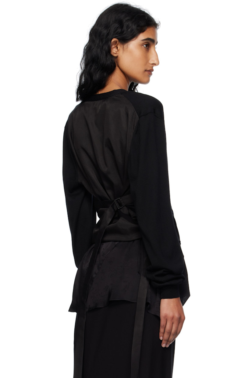 Knit wool and viscose-blend twill cardigan.

· Paneled construction
· Rib-knit Y-neck, hem, and cuffs
· Offset button closure
· Vented side seams
· Cinch straps at back

Supplier color: Black