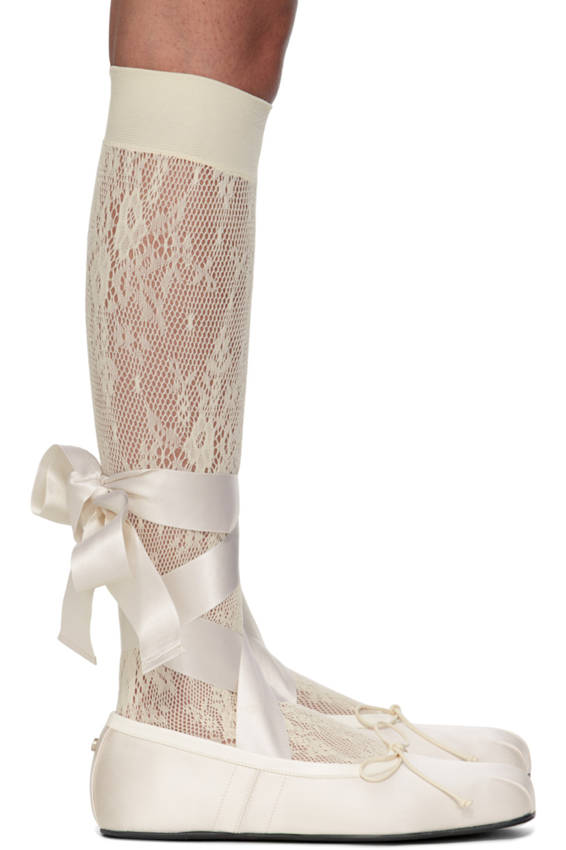 Satin ballerina flats.

· Gathering at square toe
· Bow accent at vamp
· Buffed leather trim at collar
· Wraparound self-tie ankle straps
· Rivet at heel
· Buffed leather lining
· Leather sole with rubber injection

Supplier color: Chalk