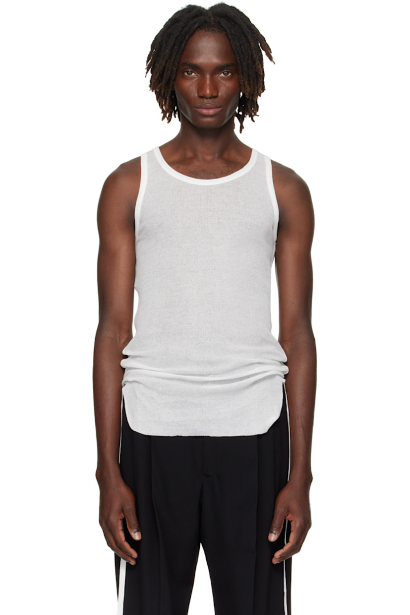 Lightweight rib-knit cotton tank top.

· Semi-sheer
· Scoop neck
· Raw edge at hem
· Ruching with grosgrain strap at sides

Supplier color: Natural White