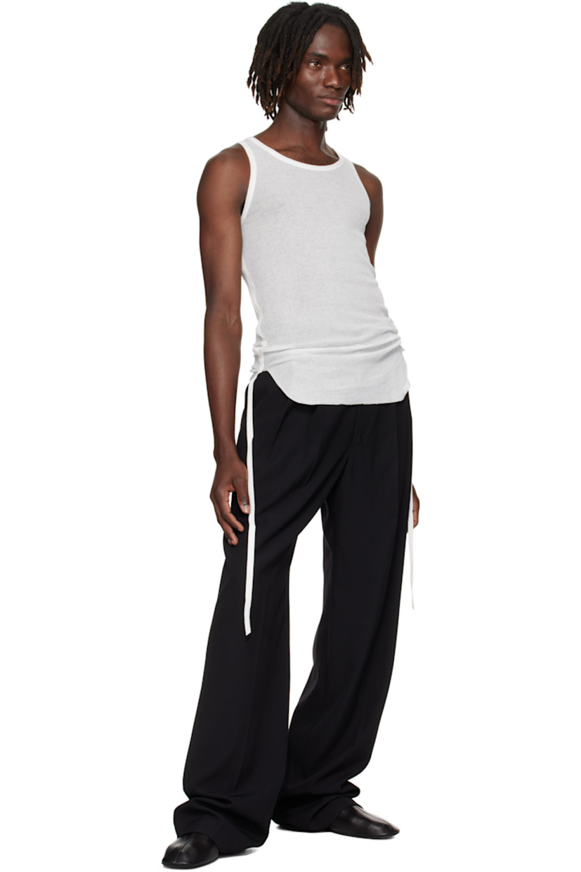 Lightweight rib-knit cotton tank top.

· Semi-sheer
· Scoop neck
· Raw edge at hem
· Ruching with grosgrain strap at sides

Supplier color: Natural White