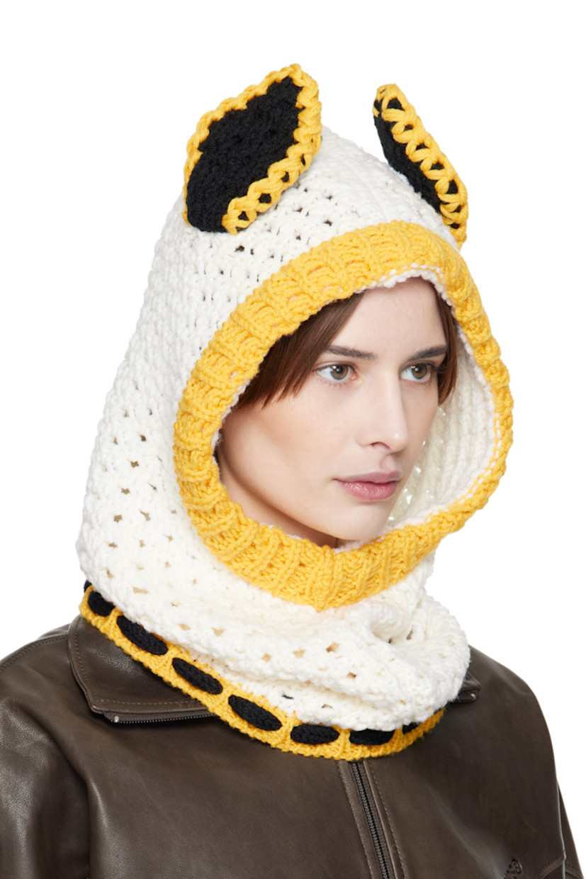 Open-knit virgin wool balaclava in off-white and yellow.

· Ear appliqués at crown
· Self-tie fastening
· Unlined

Supplier color: Lily white