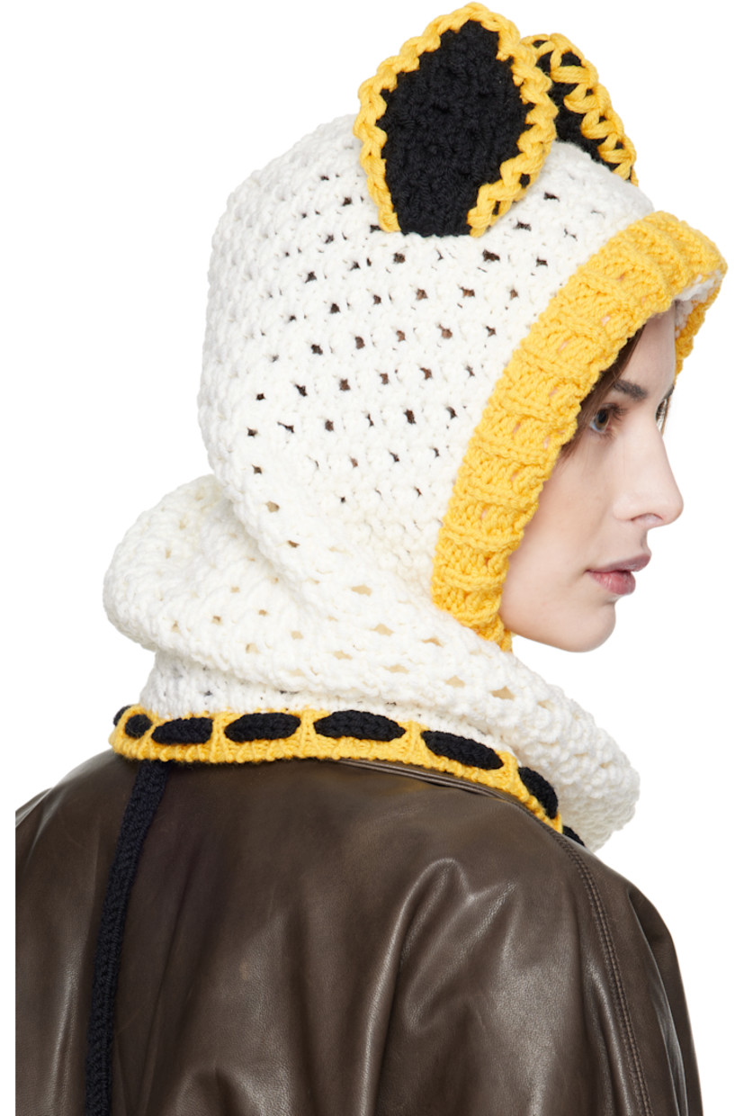 Open-knit virgin wool balaclava in off-white and yellow.

· Ear appliqués at crown
· Self-tie fastening
· Unlined

Supplier color: Lily white
