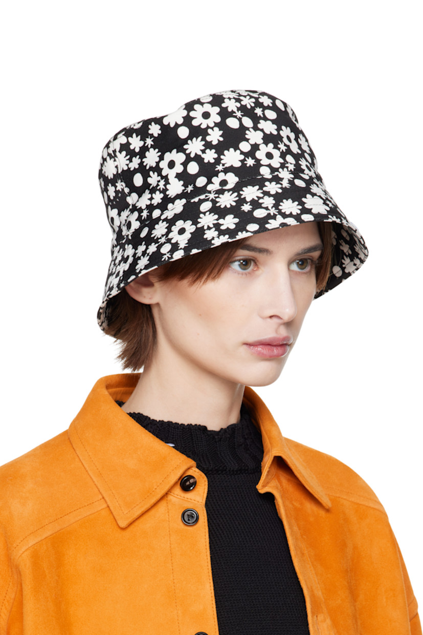 Cotton twill bucket hat in black. 

· Floral pattern printed throughout
· Logo embroidered at face
· Quilted brim
· Grosgrain browband

Supplier color: Black