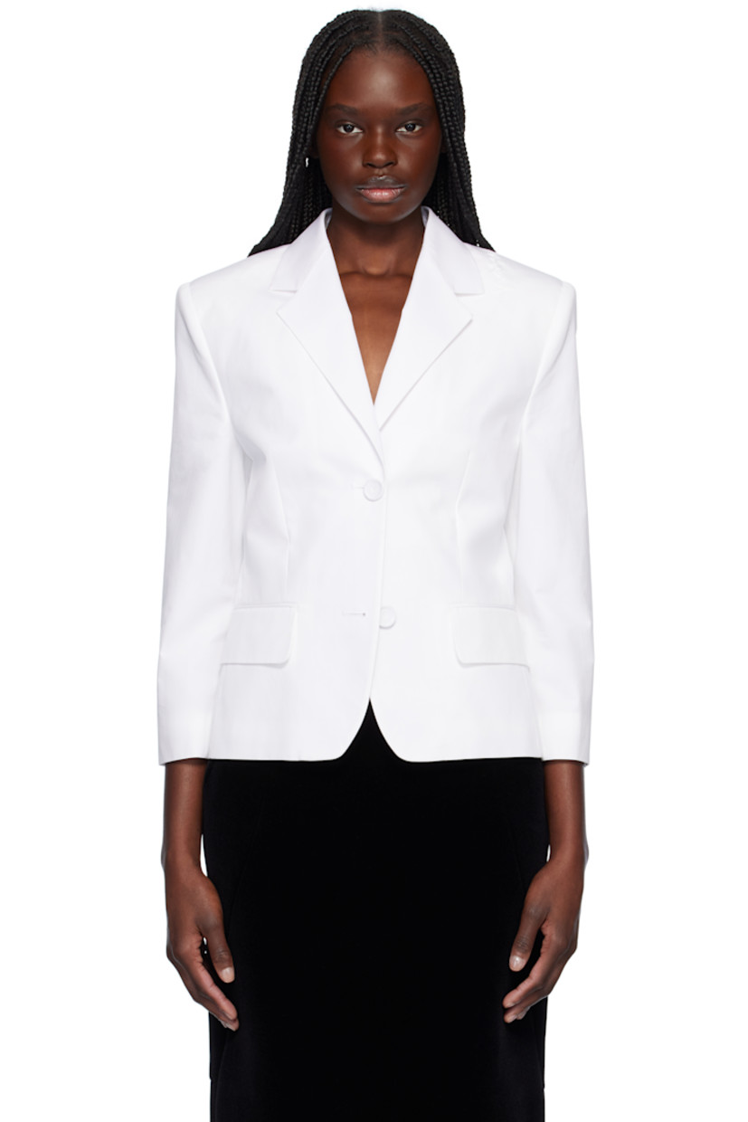 Organic cotton poplin blazer. 

· Notched lapel
· Button closure
· Darts at chest
· Flap pockets
· Logo embroidered at shoulder
· Buttoned surgeon's cuffs
· Welt pocket at interior 
· Satin-lined sleeves
· Cotton-blend twill lining

Supplier color: Lily white