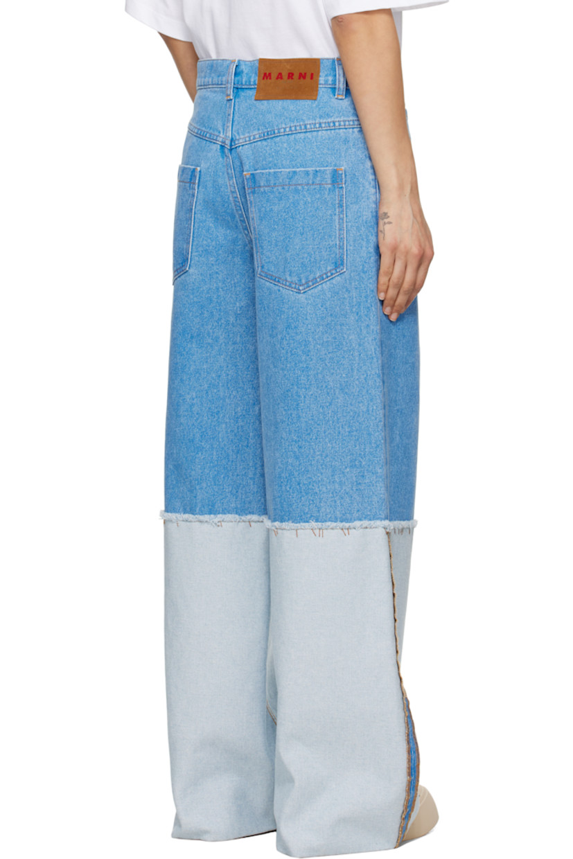 Wide-leg and loose-fit non-stretch denim jeans. Fading throughout.

· Paneled construction
· Low-rise
· Belt loops
· Five-pocket styling
· Zip-fly
· Frayed edge and topstitching at knees
· Extended rolled cuffs
· Suede logo patch at back waistband
· Logo-engraved silver-tone hardware
· Contrast stitching in tan

Supplier color: Cobalt