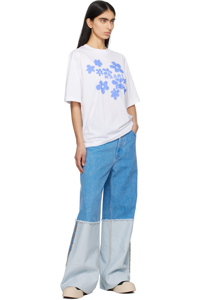 Wide-leg and loose-fit non-stretch denim jeans. Fading throughout.

· Paneled construction
· Low-rise
· Belt loops
· Five-pocket styling
· Zip-fly
· Frayed edge and topstitching at knees
· Extended rolled cuffs
· Suede logo patch at back waistband
· Logo-engraved silver-tone hardware
· Contrast stitching in tan

Supplier color: Cobalt
