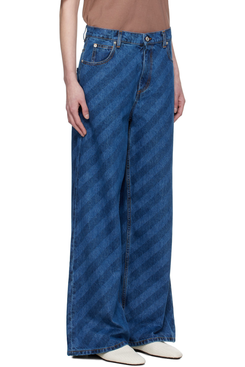 Loose-fit and wide-leg non-stretch denim jeans. Stripes throughout.

· Mid-rise
· Belt loops
· Five-pocket styling
· Zip-fly
· Logo hardware at outseam
· Logo patch at back waistband
· Logo-engraved silver-tone hardware
· Contrast stitching in tan 

Supplier color: Blue kyanite