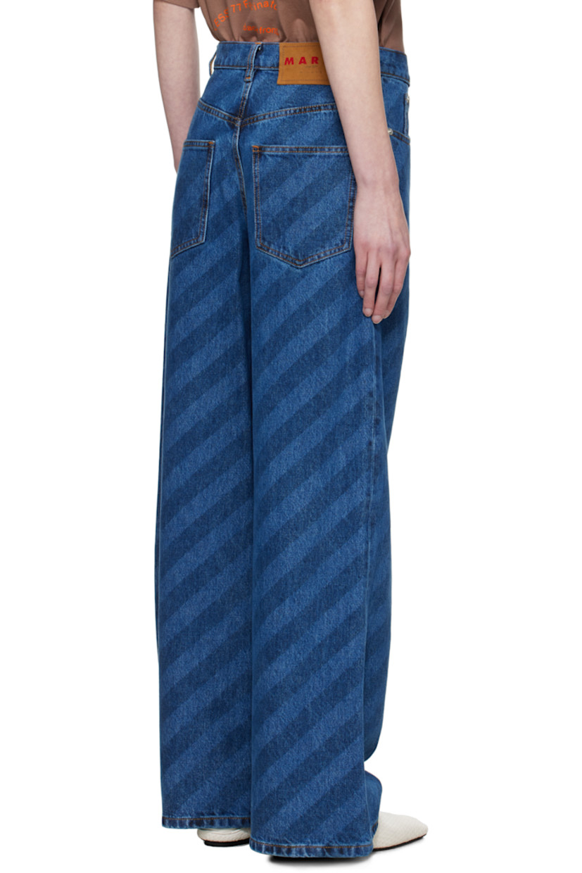Loose-fit and wide-leg non-stretch denim jeans. Stripes throughout.

· Mid-rise
· Belt loops
· Five-pocket styling
· Zip-fly
· Logo hardware at outseam
· Logo patch at back waistband
· Logo-engraved silver-tone hardware
· Contrast stitching in tan 

Supplier color: Blue kyanite