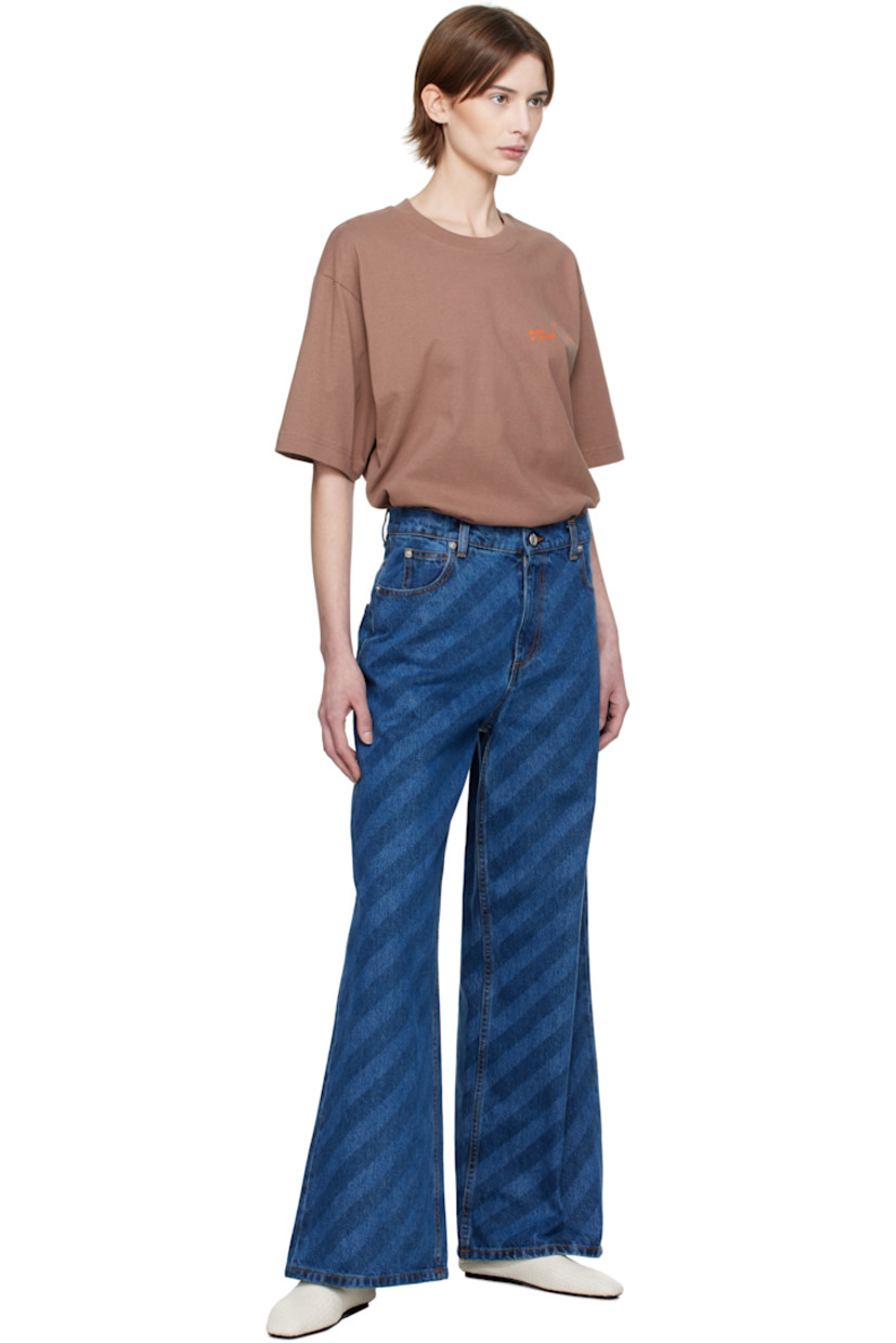 Loose-fit and wide-leg non-stretch denim jeans. Stripes throughout.

· Mid-rise
· Belt loops
· Five-pocket styling
· Zip-fly
· Logo hardware at outseam
· Logo patch at back waistband
· Logo-engraved silver-tone hardware
· Contrast stitching in tan 

Supplier color: Blue kyanite