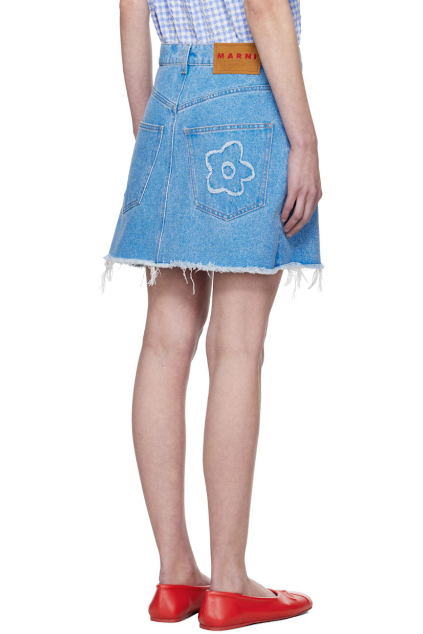 Non-stretch denim miniskirt. Fading throughout.

· Belt loops
· Five-pocket styling
· Zip fly
· Floral appliqué at front and back
· Frayed edge at flared hem
· Logo patch at back waistband
· Logo-engraved silver-tone hardware
· Contrast stitching in tan

Supplier color: Cobalt