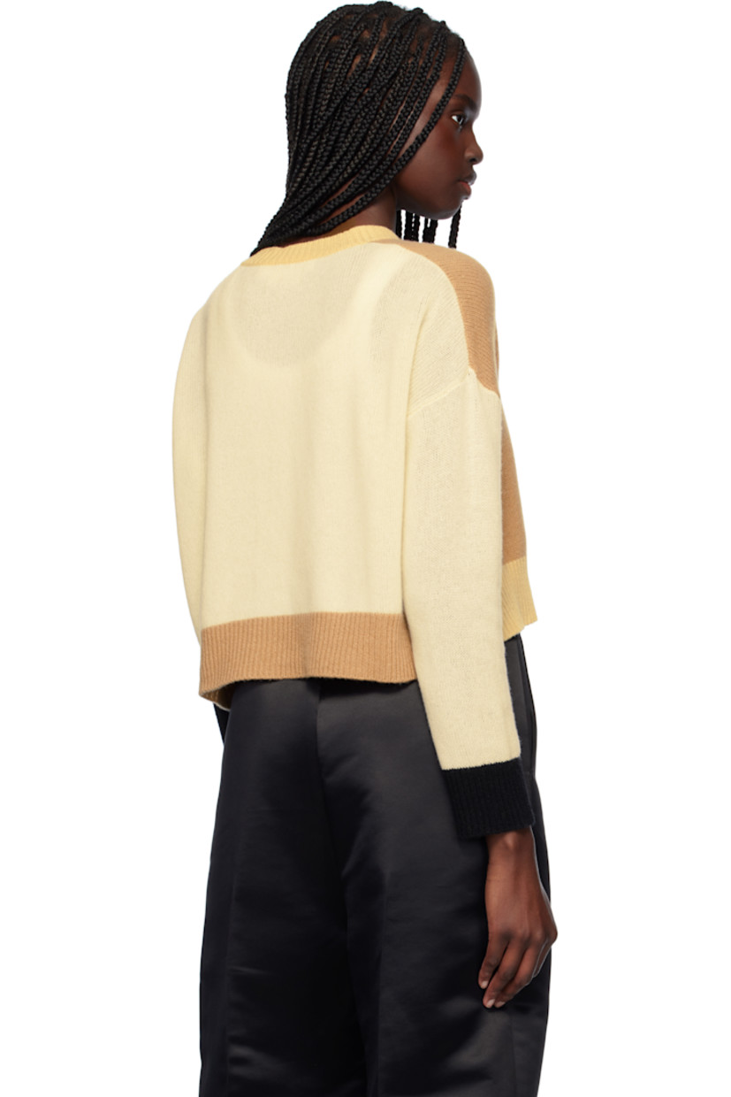 Knit cashmere cardigan. 

· Rib-knit crewneck, hem, and cuffs
· Button closure
· Hand-embroidered logo at shoulder

Supplier color: Winter wheat