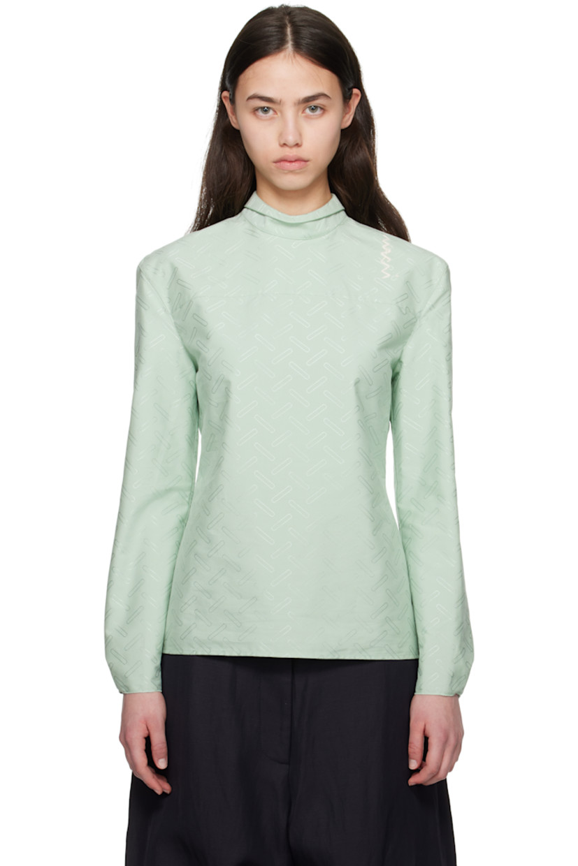 Plain-woven cotton-blend shirt. Jacquard graphic pattern throughout. 
 
· Can be worn front to back
· Spread collar
· Button closure
· Darts at front
· Pleats and raw edge at buttoned barrel cuffs
· Logo embroidered at back shoulder

Supplier color: Linden