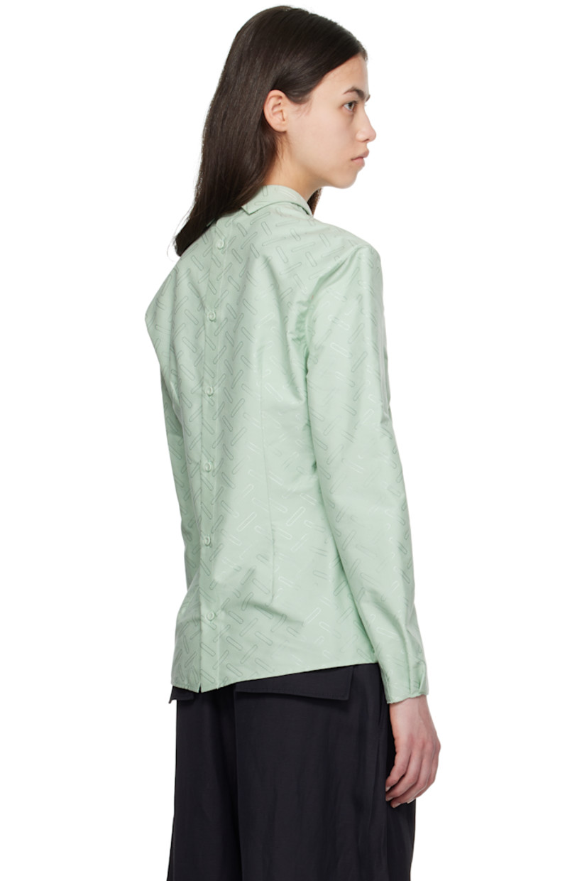 Plain-woven cotton-blend shirt. Jacquard graphic pattern throughout. 
 
· Can be worn front to back
· Spread collar
· Button closure
· Darts at front
· Pleats and raw edge at buttoned barrel cuffs
· Logo embroidered at back shoulder

Supplier color: Linden