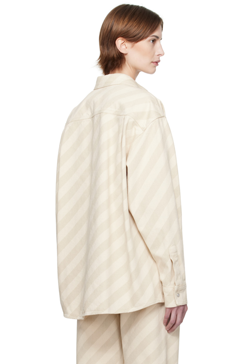 Non-stretch denim shirt. Stripes throughout. 

· Spread collar
· Press-stud closure
· Patch pockets
· Shirttail hem
· Logo appliqué at shoulder 
· Dropped shoulders
· Pleat and press-stud fastening at cuffs
· Twin pleats at yoke 

Supplier color: Bone