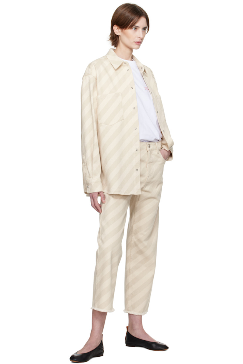 Non-stretch denim shirt. Stripes throughout. 

· Spread collar
· Press-stud closure
· Patch pockets
· Shirttail hem
· Logo appliqué at shoulder 
· Dropped shoulders
· Pleat and press-stud fastening at cuffs
· Twin pleats at yoke 

Supplier color: Bone