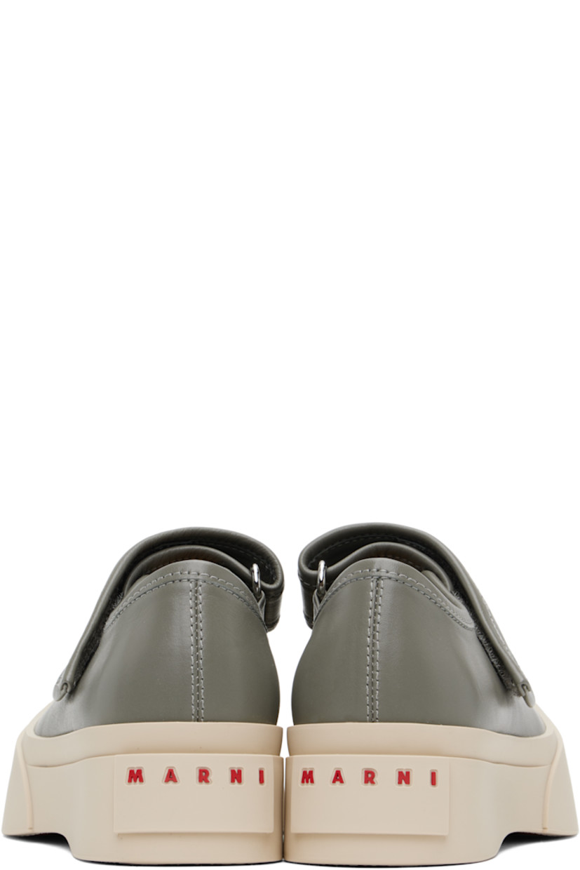 Low-top buffed nappa calfskin Mary Jane-style sneakers in gray.

· Rubber cap toe
· Velcro strap at vamp
· Metal eyelets at inner side
· Buffed sheepskin lining
· Logo embossed at heel
· Treaded rubber platform sole
· Platform: H1.75"

Supplier color: Neutral grey