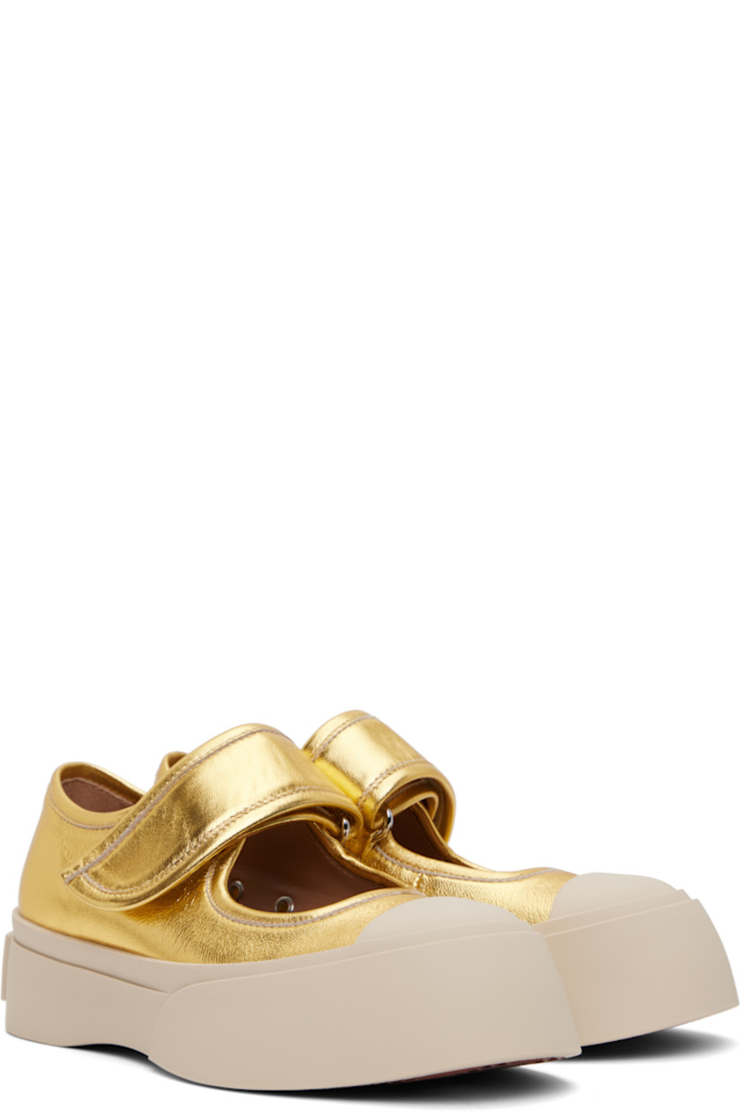 Grained leather Mary Jane-style ballerina flats in gold tone.

· Rubber cap toe
· Velcro strap at vamp
· Metal eyelets at inner side
· Buffed calfskin lining
· Logo embossed at heel
· Treaded rubber platform sole
· Platform: H1.75"

Supplier color: Gold
