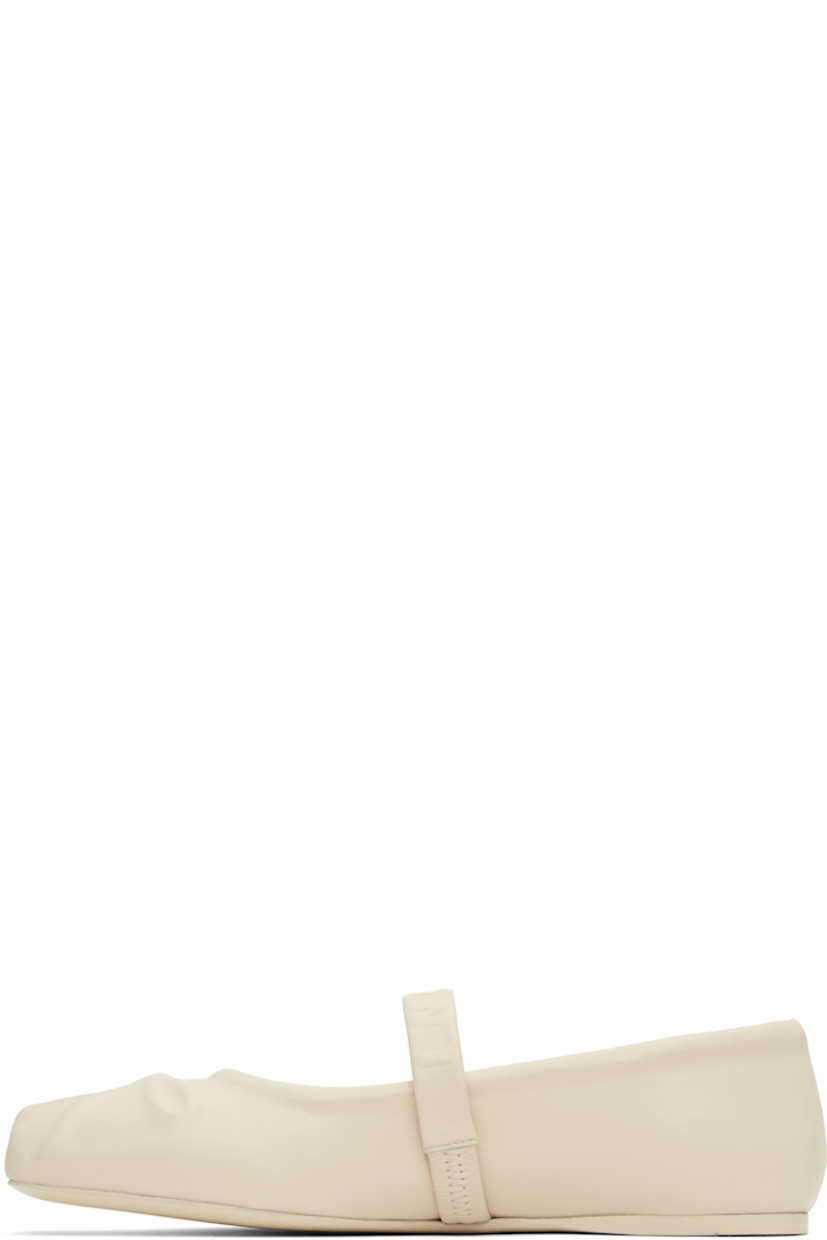 Buffed leather Mary Jane-style ballerina flats in off-white.

· Embossed bow graphic at square toe
· Logo-embossed elasticized strap at vamp
· Suede and buffed leather lining
· Leather sole with rubber injection

Supplier color: Limestone