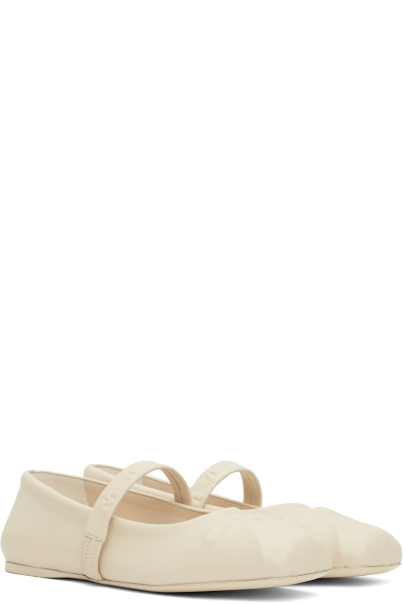 Buffed leather Mary Jane-style ballerina flats in off-white.

· Embossed bow graphic at square toe
· Logo-embossed elasticized strap at vamp
· Suede and buffed leather lining
· Leather sole with rubber injection

Supplier color: Limestone