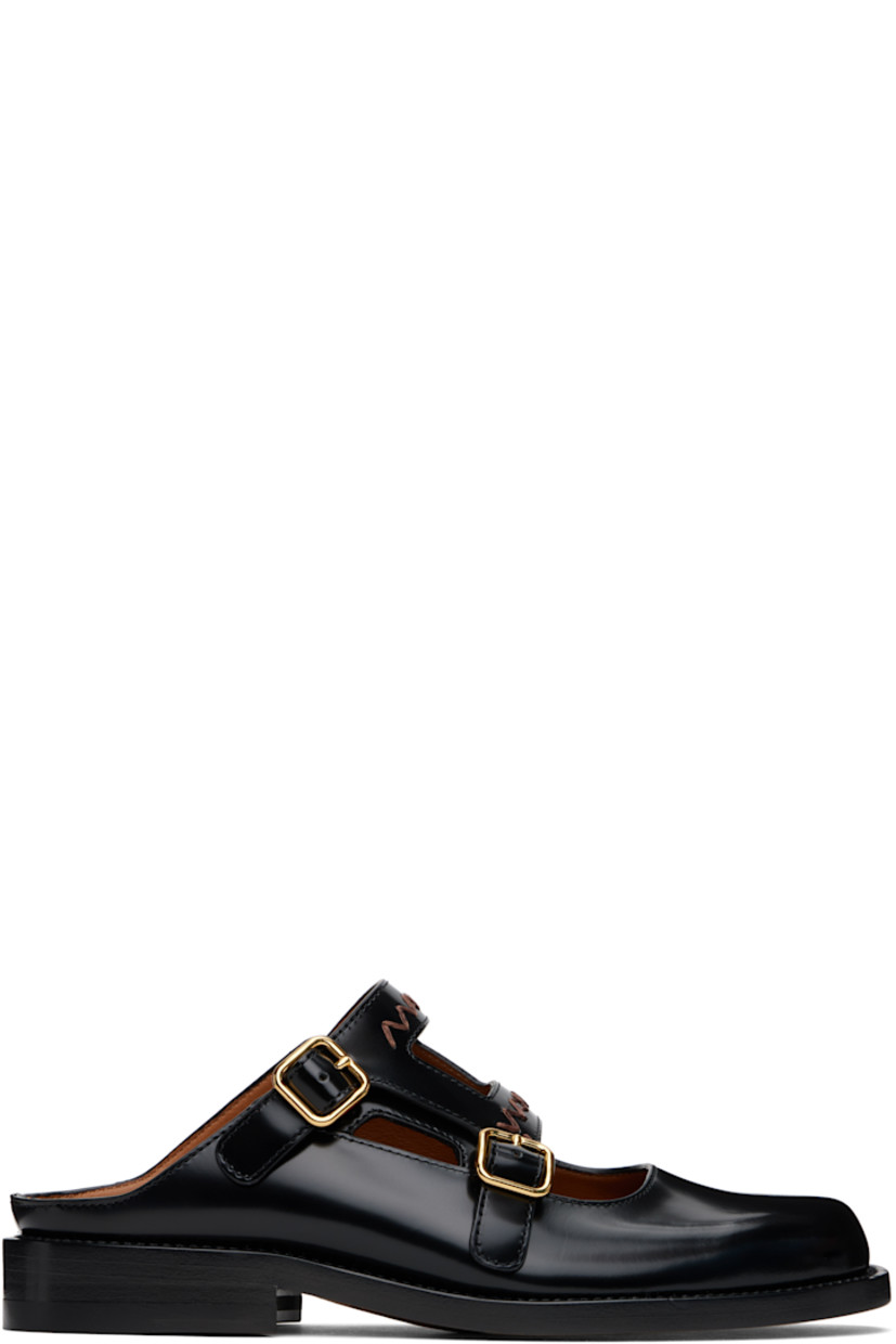 Polished calfskin Mary Jane-style slip-on loafers in black. 

· Pin-buckle straps with hand-embroidered logos at vamp
· Logo embossed at calfskin footbed
· Buffed calfskin lining
· Stacked calfskin heel with rubber injection
· Calfskin sole

Supplier color: Black