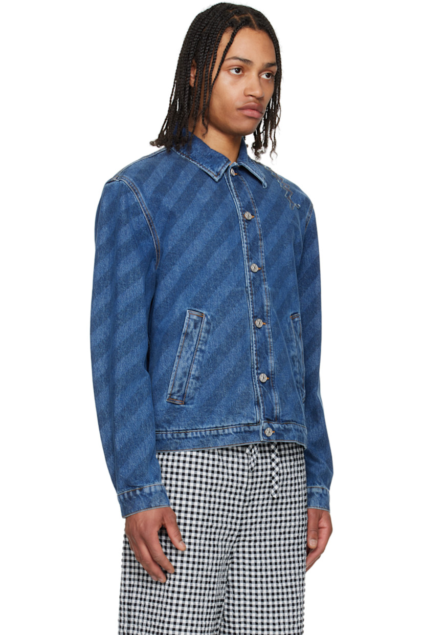 Non-stretch denim jacket. Stripes and fading throughout.

· Spread collar
· Button closure
· Welt pockets
· Logo appliqué at shoulder
· Buttoned barrel cuffs
· Adjustable button tabs at back hem
· Contrast stitching in tan

Supplier color: Blue kyanite