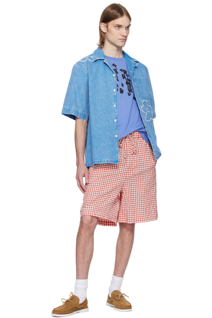 Non-stretch denim shirt. Fading throughout.

· Open spread collar
· Button closure
· Patch pocket at chest
· Frayed floral appliqué at front and shoulder
· Vent at side seams
· Hand-stitched logo at shoulder
· Mother-of-pearl hardware
· Contrast stitching in tan

Supplier color: Cobalt