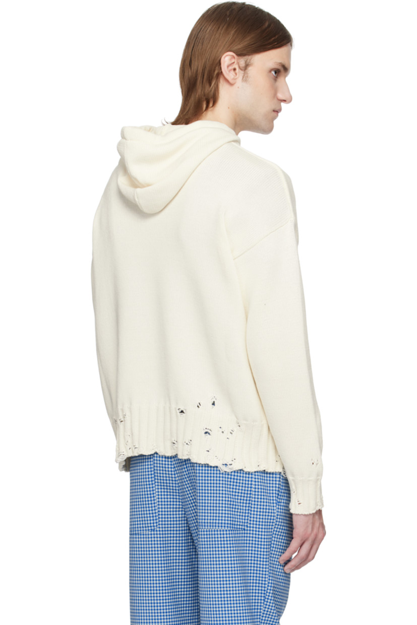 Knit cotton hoodie. Distressing throughout.

· Drawstring at hood
· Rib-knit trim at hood and kangaroo pocket
· Hand-stitched logo at collar
· Rib-knit hem and cuffs
· Dropped shoulders

Supplier color: Lily white