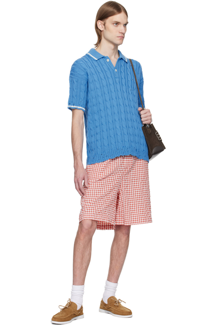Cable-knit cotton polo. Distressing throughout.

· Rib-knit spread collar, hem, and cuffs
· Stripe at collar and cuffs
· Two-button placket
· Hand-stitched logo at shoulder
· Dropped shoulders

Supplier color: Azure