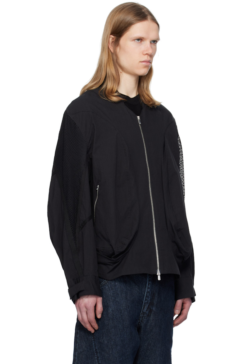 Cotton- and nylon-blend taffeta bomber jacket. 

· Stand collar 
· Two-way zip closure 
· Zip pockets 
· Concealed bungee-style drawstring at hem 
· Pleat at side seams 
· Mesh and webbing trim at yoke sleeves
· Adjustable velcro fastening at cuffs 
· Patch pocket at interior 
· Full satin lining 

Supplier color: Black