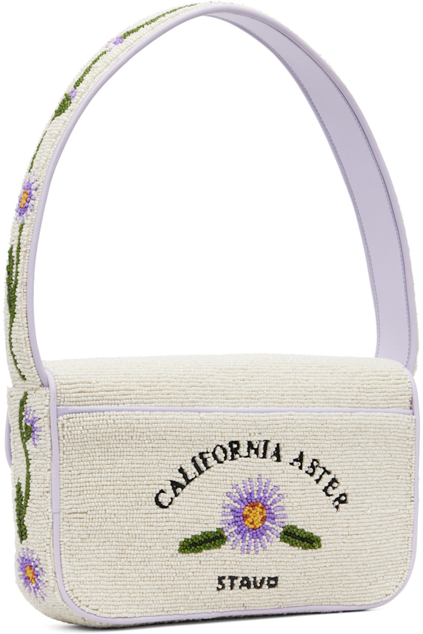 Hand-beaded shoulder bag.

· Beaded floral graphics and faux-leather trim throughout
· Fixed shoulder strap
· Text embroidered at face and back face
· Patch pocket and beaded logo at back face
· Magnetic press-stud flap
· Zip pocket at interior
· Satin lining
· H6.25" x W10" x D2"

Supplier color: California aster