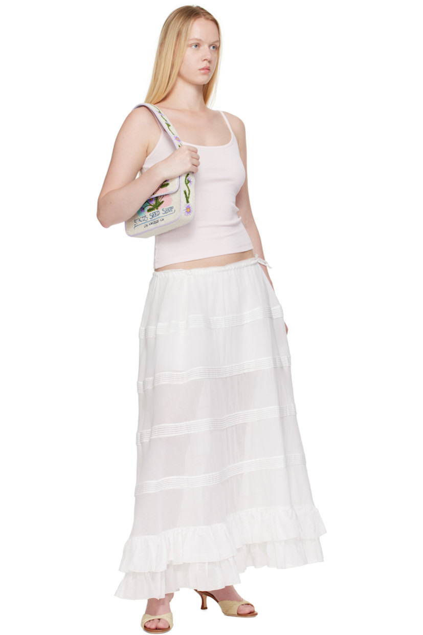 Hand-beaded shoulder bag.

· Beaded floral graphics and faux-leather trim throughout
· Fixed shoulder strap
· Text embroidered at face and back face
· Patch pocket and beaded logo at back face
· Magnetic press-stud flap
· Zip pocket at interior
· Satin lining
· H6.25" x W10" x D2"

Supplier color: California aster