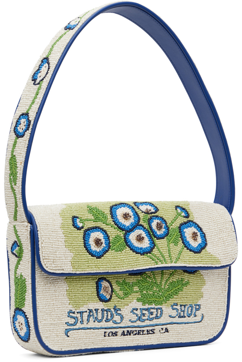 Hand-beaded shoulder bag.

· Beaded floral graphics and faux-leather trim throughout
· Fixed shoulder strap
· Text embroidered at face and back face
· Patch pocket and beaded logo at back face
· Magnetic press-stud flap
· Zip pocket at interior
· Satin lining
· H6.25" x W10" x D2"

Supplier color: Baby blue eyes