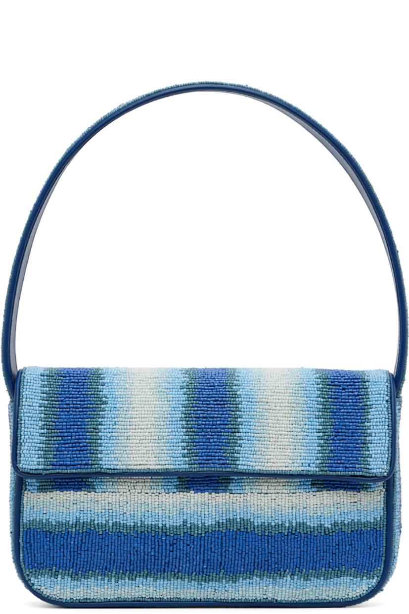 Hand-beaded shoulder bag.

· Stripes and faux-leather trim throughout
· Fixed shoulder strap
· Patch pocket and beaded logo at back face
· Magnetic press-stud flap
· Zip pocket at interior
· Satin lining
· H6.25" x W10" x D2"

Supplier color: Ride the wave