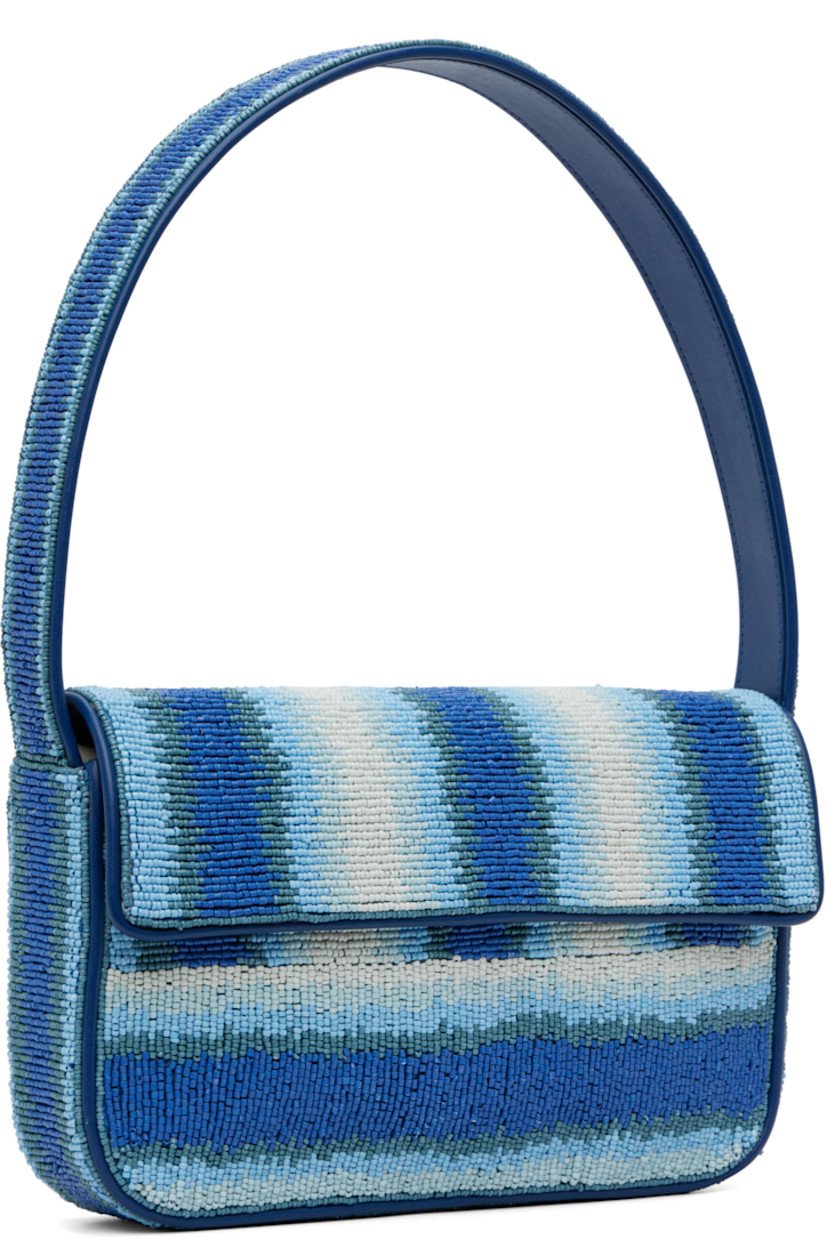 Hand-beaded shoulder bag.

· Stripes and faux-leather trim throughout
· Fixed shoulder strap
· Patch pocket and beaded logo at back face
· Magnetic press-stud flap
· Zip pocket at interior
· Satin lining
· H6.25" x W10" x D2"

Supplier color: Ride the wave