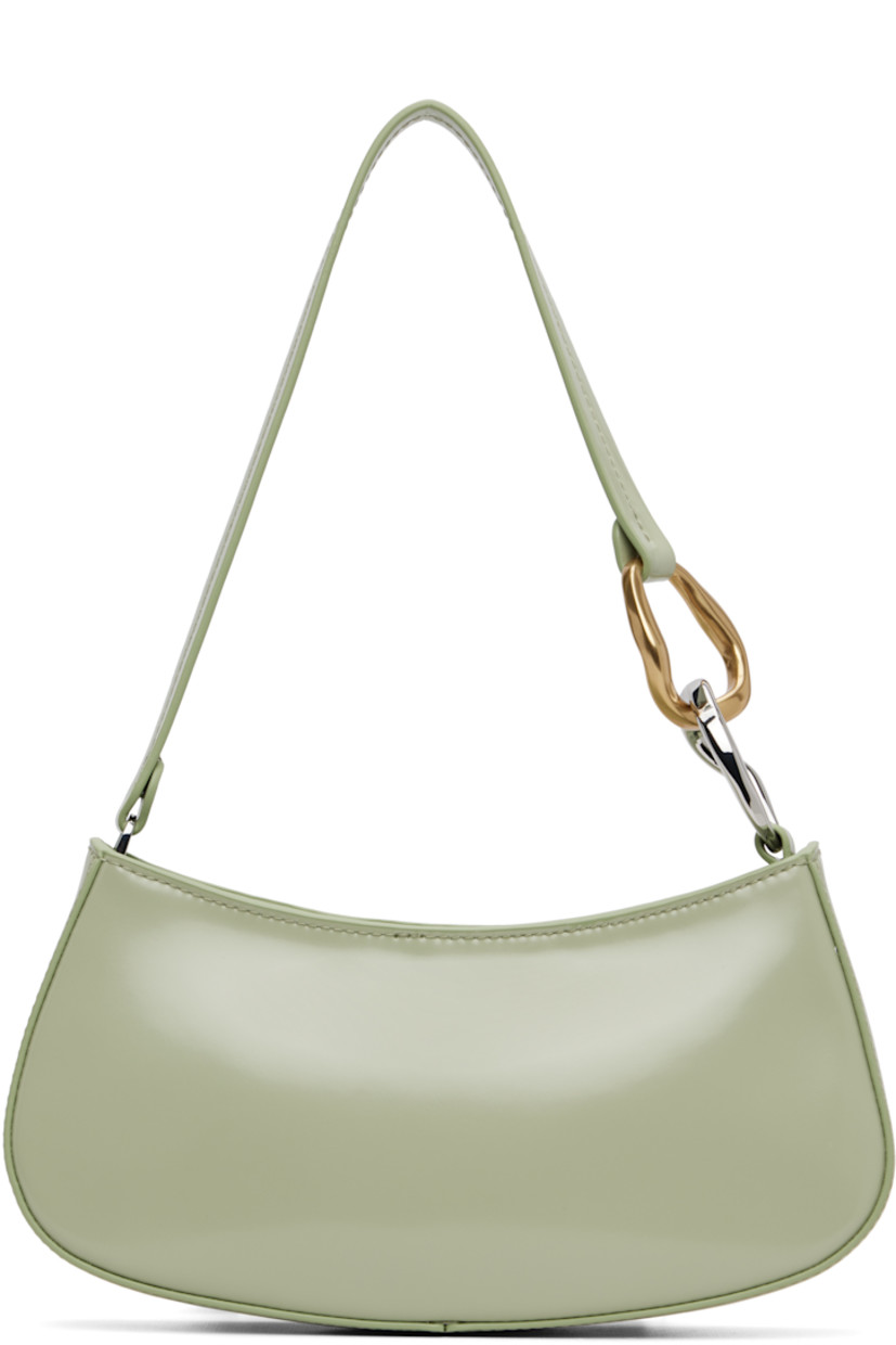 Polished leather shoulder bag.

· Curb chain hardware at fixed shoulder strap
· Logo embossed at back face
· Zip closure
· Zip pocket and patch pocket at interior
· Suede lining
· Silver-tone and gold-tone hardware
· H4.25" x W9.5" x D2"

Supplier color: Pale jade