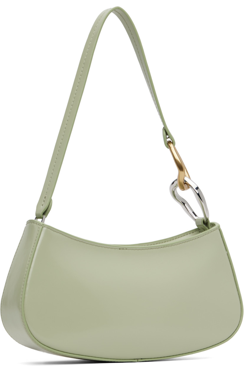 Polished leather shoulder bag.

· Curb chain hardware at fixed shoulder strap
· Logo embossed at back face
· Zip closure
· Zip pocket and patch pocket at interior
· Suede lining
· Silver-tone and gold-tone hardware
· H4.25" x W9.5" x D2"

Supplier color: Pale jade