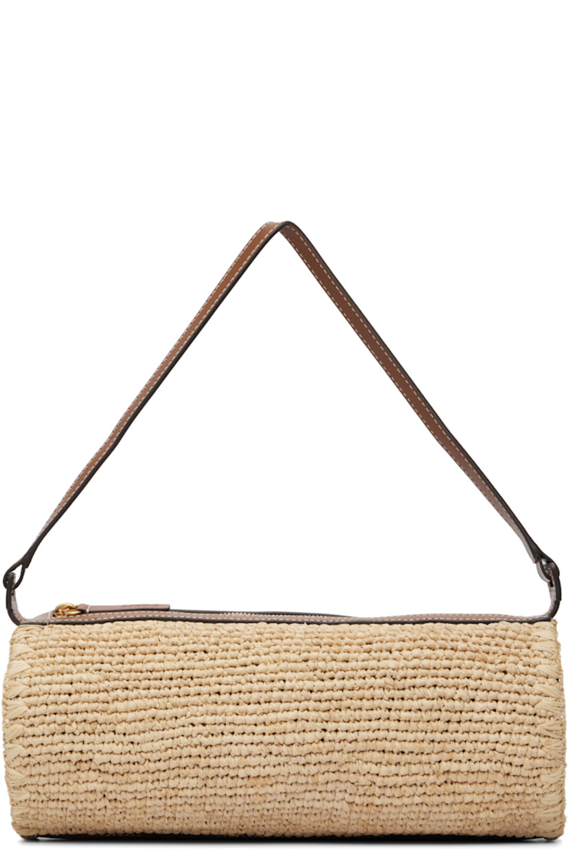 Hand-woven raffia and buffed leather shoulder bag.

· Fixed shoulder strap
· Logo embossed at side
· Zip closure
· Patch pocket at interior
· Unlined
· Contrast stitching in white
· H4.5" x W11.25" x D4.5"

Supplier color: Natural/Tan