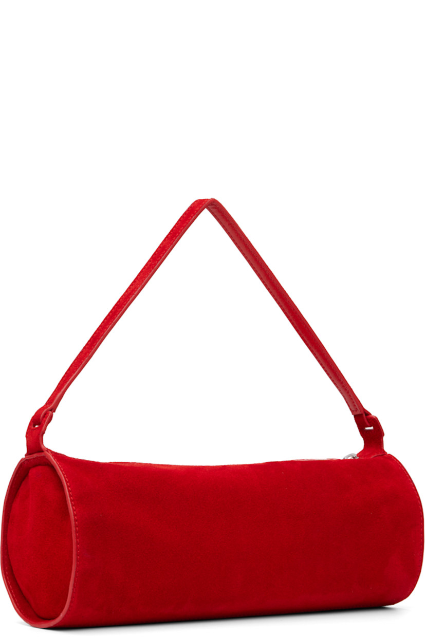 Suede shoulder bag.

· Fixed shoulder strap
· Logo embossed at side
· Zip closure
· Zip pocket at interior
· Faille lining
· H4.5" x W11.25" x D4.5"

Supplier color: Red rose