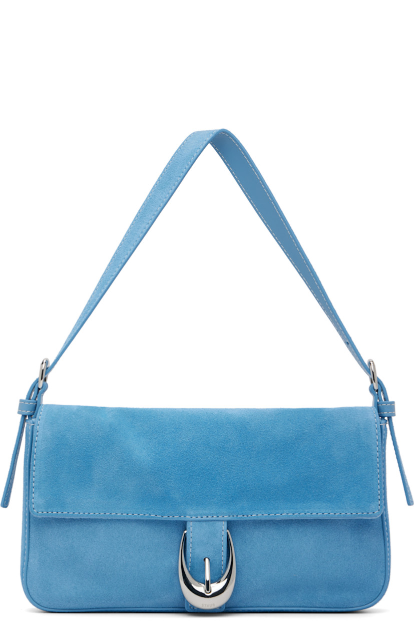Suede shoulder bag.

· Adjustable shoulder strap
· Logo embossed at back face
· Pin-buckle hardware at magnetic press-stud flap
· Zip pocket at interior
· Logo-engraved silver-tone hardware
· H5" x W9.75" x D1.5"

Supplier color: Staud blue